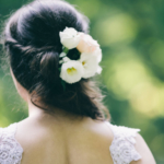 Back of a woman with beautiful hairstyle and white dress