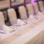 Place settings at the head table of a wedding at Mercure Hotels