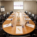 Table and chairs ready for a meeting in the Ambassador Room