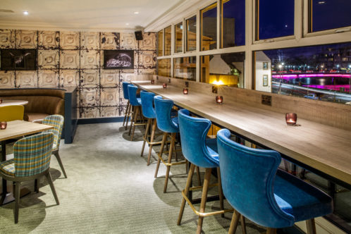 Breakfast bar overlooking river ness and bridge at night