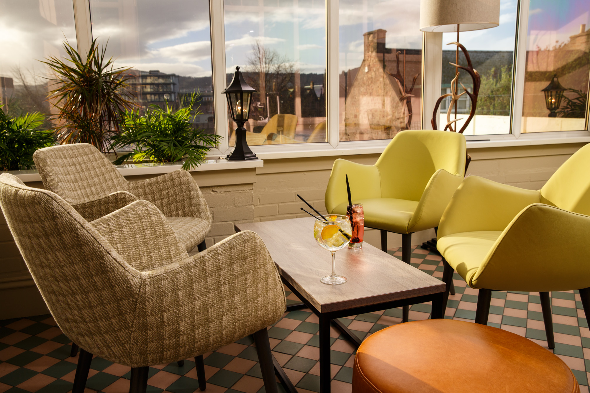 Drinks on a table in the conservatory overlooking the river ness at mercure inverness hotel