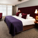 Double bed with desk and HD TV in mercure inverness hotel privilege bedroom