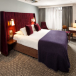 Double bed with desk and HD TV in mercure inverness hotel privilege bedroom