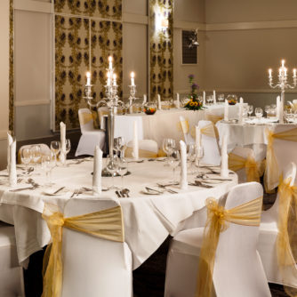 The Inverness suite with tables and chairs dressed for a wedding at mercure inverness hotel