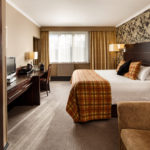 Double bed with desk and HD TV in mercure inverness hotel superior bedroom